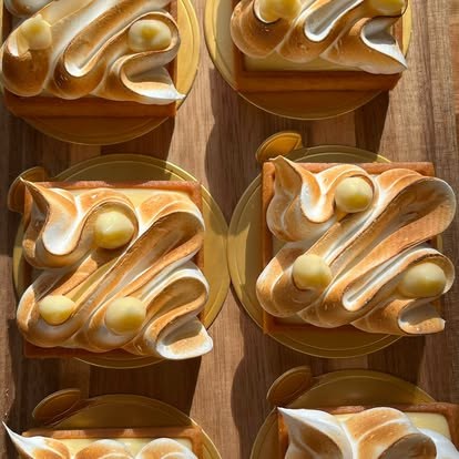 Individual lemon meringue tarts with torched Italian meringue